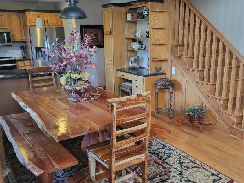 377 Riverwood Road, Mooresville, NC 28117.  MLS# CAR4192992, YatesRealty ID 11616. View of dining and stairwell up to primary ensuite.  Built-in desk area.