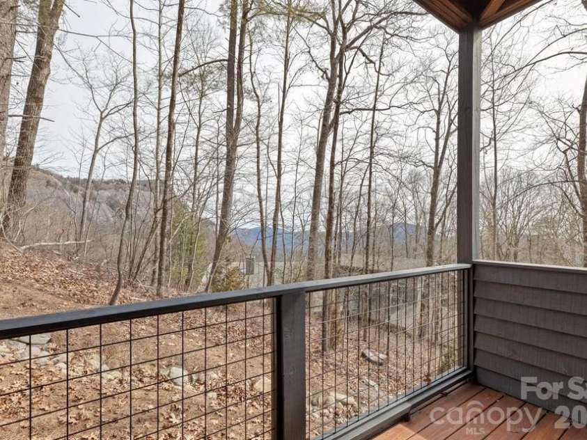692 Lost Trail, Highlands, NC 28741.  MLS# CAR4360852, YatesRealty ID 11617. Deck off the Guest Room 1 on Lower Level