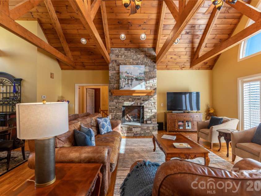 446 Windridge Drive, Sugar Grove, NC 28679.  MLS# CAR4360975, YatesRealty ID 11618. Floor to ceiling stacked stone fireplace makes for cozy gathering spot