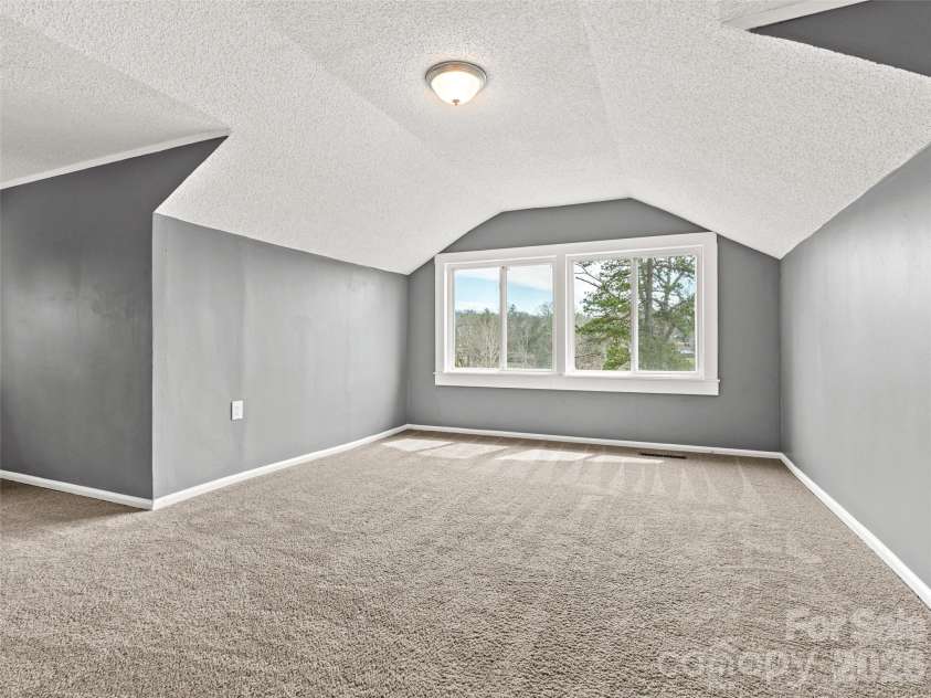 15 Woodbine Road, Asheville, NC 28804.  MLS# CAR4360828, YatesRealty ID 11619. Upstairs bedroom 1.