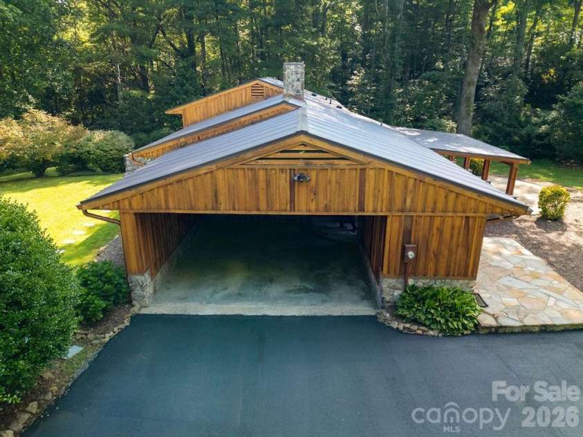 100 Ashton Lane, Brevard, NC 28712.  MLS# CAR4411812, YatesRealty ID 11621. Double Carport