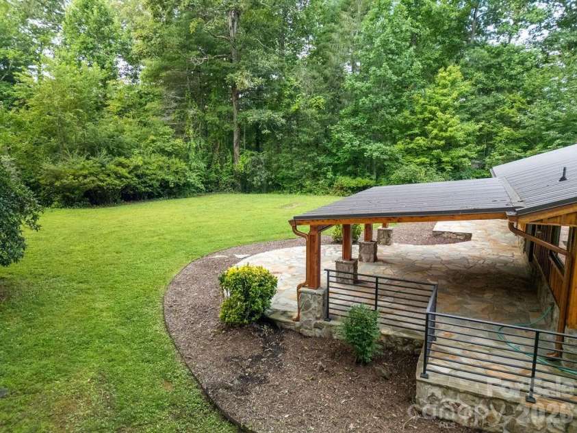 100 Ashton Lane, Brevard, NC 28712.  MLS# CAR4411812, YatesRealty ID 11621. Flagstone Rear Deck and Patio