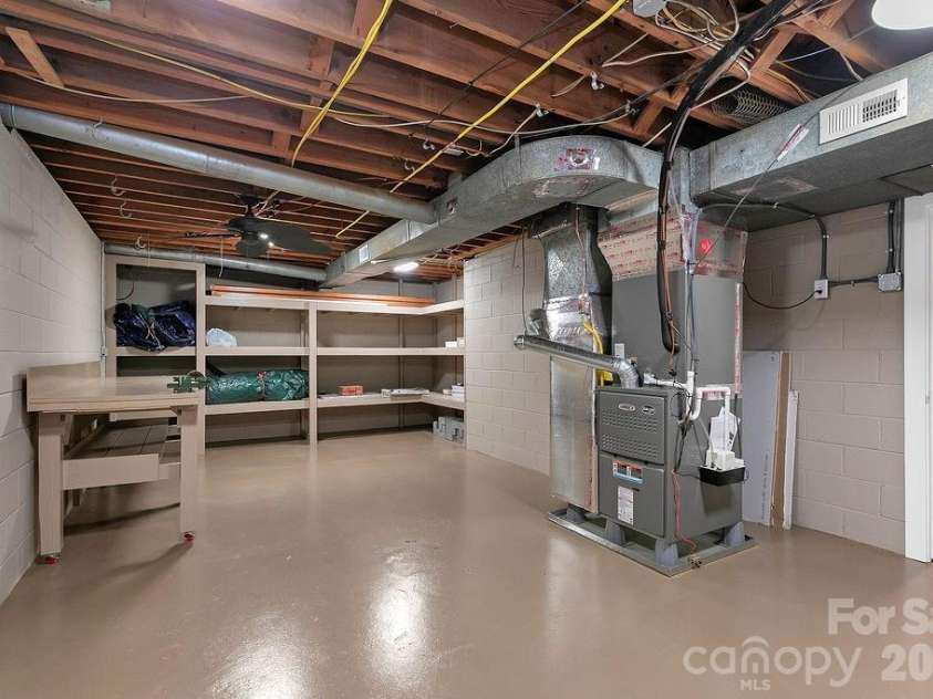 100 Ashton Lane, Brevard, NC 28712.  MLS# CAR4411812, YatesRealty ID 11621. Heated and Cooled Workshop/Utility Room