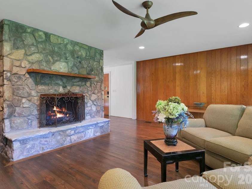 100 Ashton Lane, Brevard, NC 28712.  MLS# CAR4411812, YatesRealty ID 11621. Massive Stone Fireplave