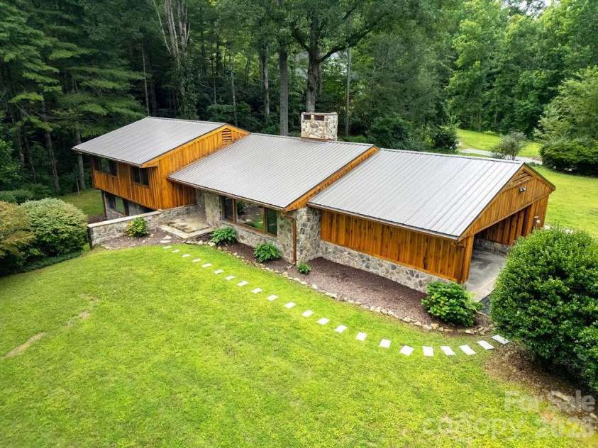 100 Ashton Lane, Brevard, NC 28712.  MLS# CAR4411812, YatesRealty ID 11621. Park-like Setting