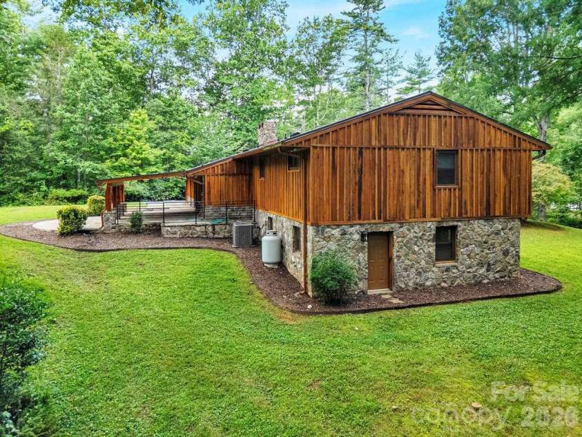 100 Ashton Lane, Brevard, NC 28712.  MLS# CAR4411812, YatesRealty ID 11621. Side Yard
