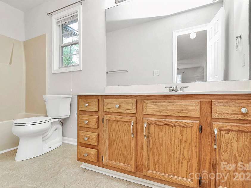 5114 Daffodil Lane, Concord, NC 28025.  MLS# CAR4253116, YatesRealty ID 11629. Owners' bathroom
