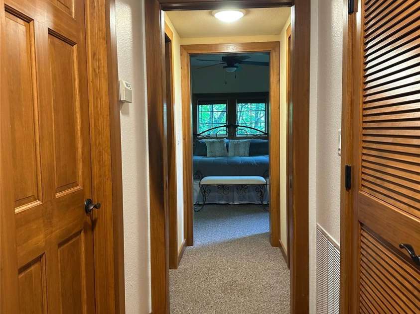 222 Creekside Way, Burnsville, NC 28714.  MLS# CAR4250039, YatesRealty ID 1163. Hallway to Primary Bedroom