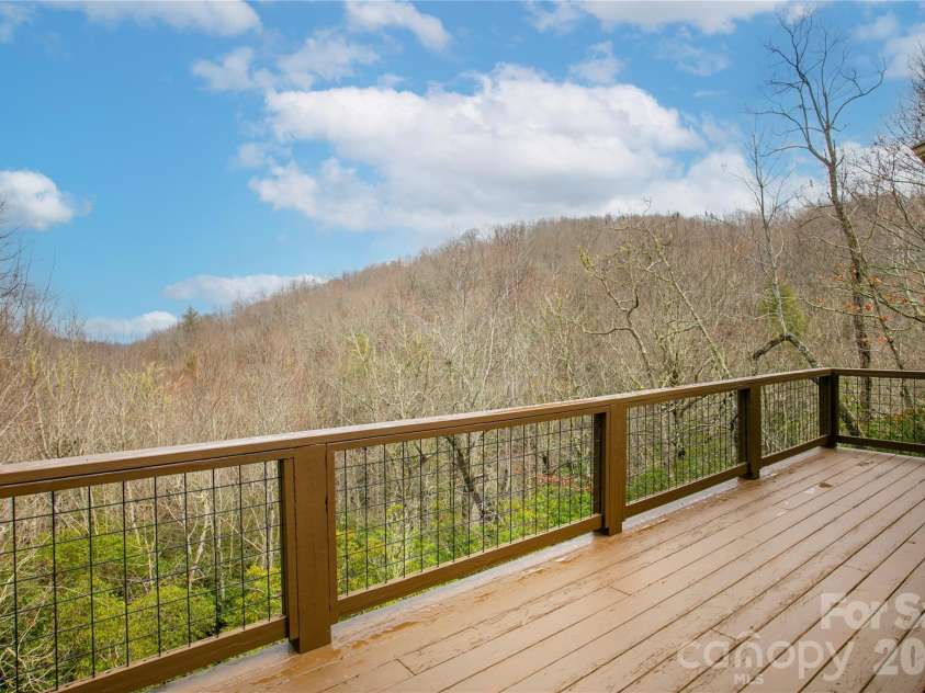 123 Isuhdavga Court, Brevard, NC 28712.  MLS# CAR4354135, YatesRealty ID 11633. Long Range Deck views