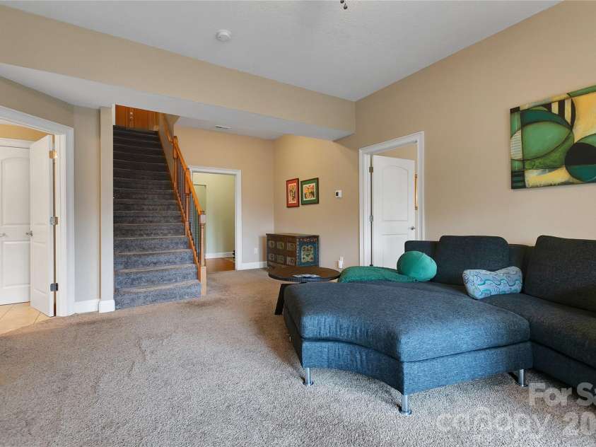 123 Isuhdavga Court, Brevard, NC 28712.  MLS# CAR4354135, YatesRealty ID 11633. Staircase to Lower Level