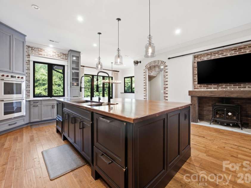 6207 Victory Pass Lane, Waxhaw, NC 28173.  MLS# CAR4398111, YatesRealty ID 11639. Kitchen with Fireplace and Keeping room
