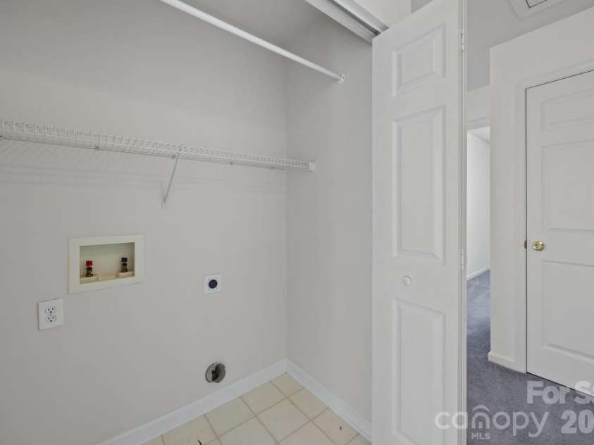 3228 Mannington Drive, Charlotte, NC 28270.  MLS# CAR4363224, YatesRealty ID 11652. Laundry area conveniently located on upper level.