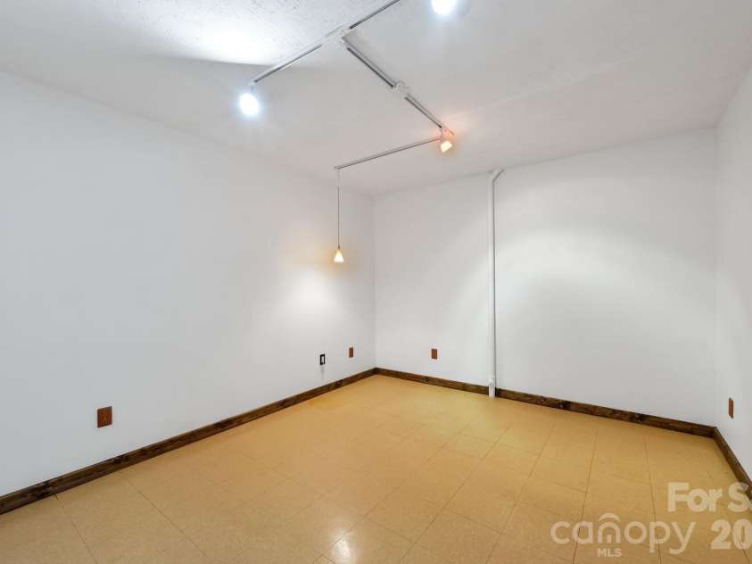 2 Ruffed Grouse Drive, Weaverville, NC 28787.  MLS# CAR4330226, YatesRealty ID 11659. Basement work room /expansion space