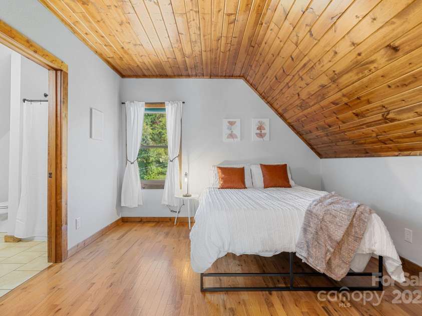 311 Banks Creek Road, Burnsville, NC 28714.  MLS# CAR4251059, YatesRealty ID 11662. Cozy loft bedroom with ensuite bathroom.