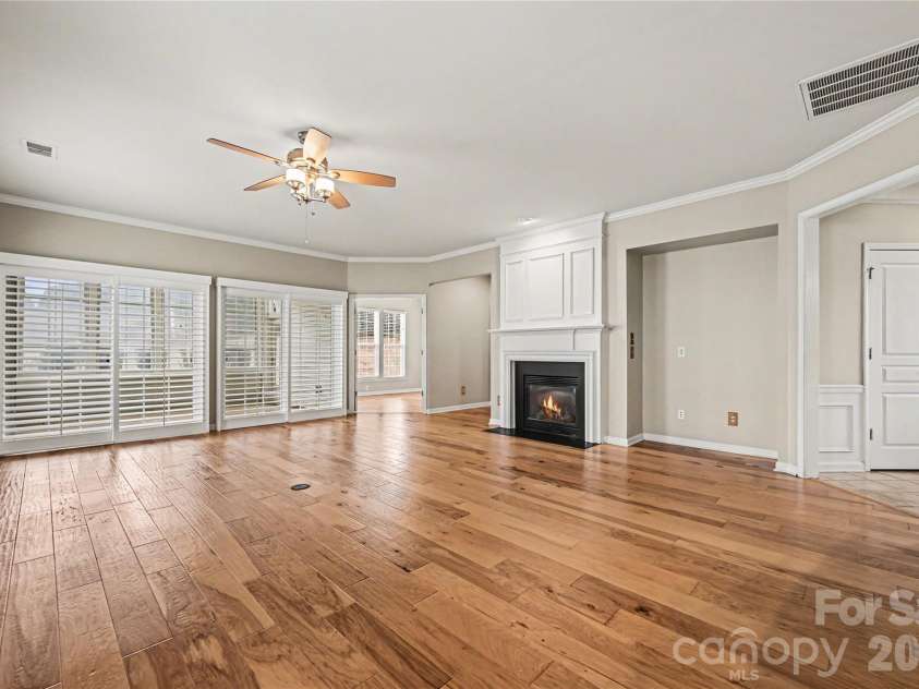 57106 Nightingale Way, Indian Land, SC 29707.  MLS# CAR4349782, YatesRealty ID 11662. Beautiful great room has sliding louvered doors that open out to the 3-season screened porch.