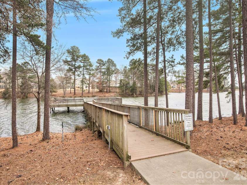 57106 Nightingale Way, Indian Land, SC 29707.  MLS# CAR4349782, YatesRealty ID 11662. Dock behind the Lake House