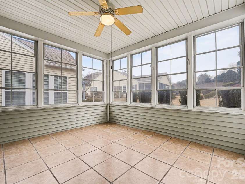 57106 Nightingale Way, Indian Land, SC 29707.  MLS# CAR4349782, YatesRealty ID 11662. Screened porch is a great area to relax, work on a project, or visit with  guests.