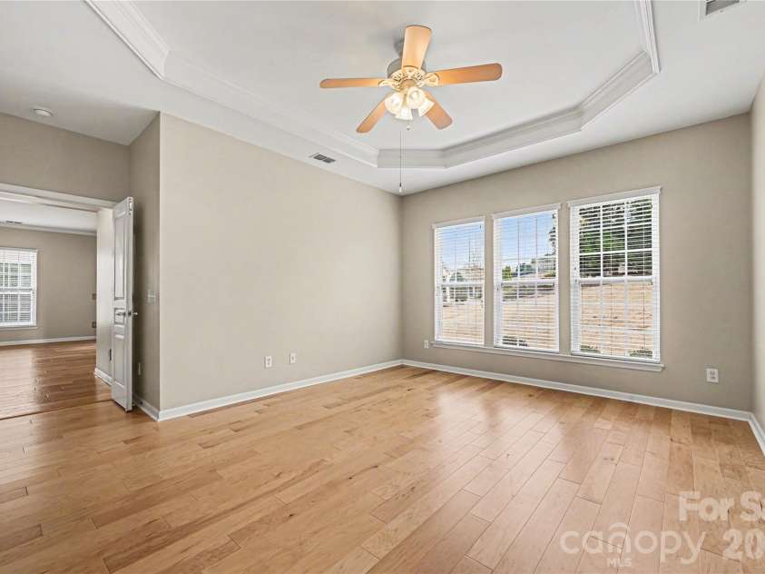 57106 Nightingale Way, Indian Land, SC 29707.  MLS# CAR4349782, YatesRealty ID 11662. Spacious primary bedroom overlooks the backyard.