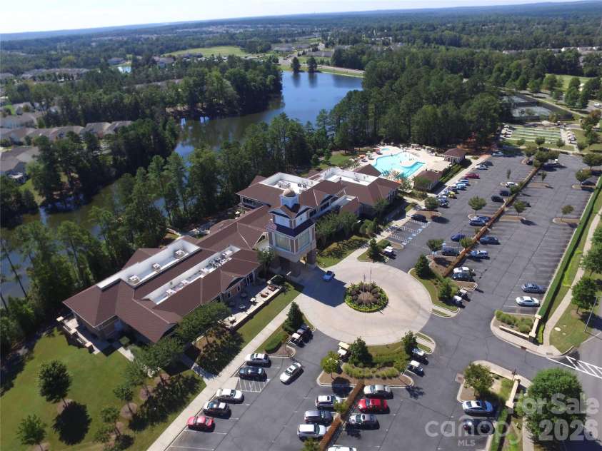 57106 Nightingale Way, Indian Land, SC 29707.  MLS# CAR4349782, YatesRealty ID 11662. The Lake House is the main hub of the community and boasts a beautiful lobby with fireplace and view of the lake, 2-story state-of-the-art fitness center, billiards, cards, table tennis areas, card & meeting rooms,