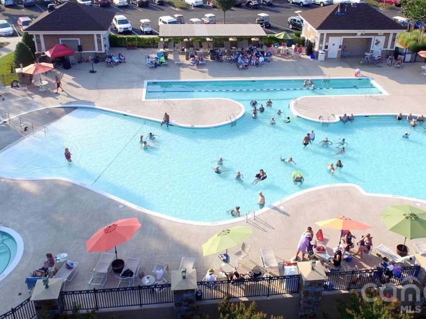 57106 Nightingale Way, Indian Land, SC 29707.  MLS# CAR4349782, YatesRealty ID 11662. The Lake House pool is one of three pools at Sun City Carolina Lakes. There is also a pool inside The Lake House and another outdoor pool at The Lodge.