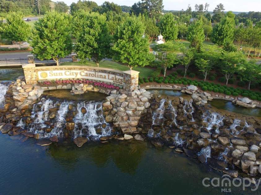 57106 Nightingale Way, Indian Land, SC 29707.  MLS# CAR4349782, YatesRealty ID 11662. The majestic entrance to Sun City Carolina Lakes welcomes residents and guests to this premier active adult community. Come live the dream!