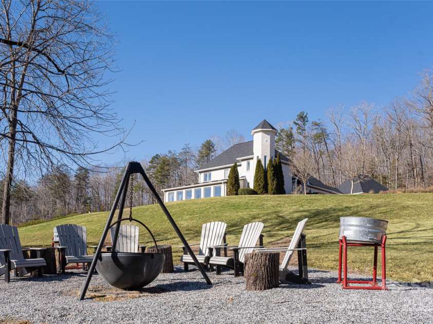 300 Springhill Drive, Rutherfordton, NC 28139.  MLS# CAR4152594, YatesRealty ID 1167. Fire pit near pond