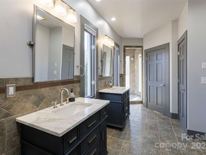 300 Springhill Drive, Rutherfordton, NC 28139.  MLS# CAR4152594, YatesRealty ID 1167. Primary bathroom shower & separate tub