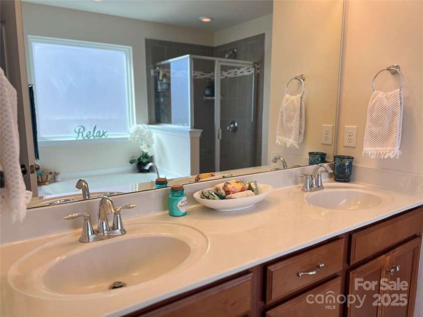 121 Mackinac Drive, Mooresville, NC 28117.  MLS# CAR4218931, YatesRealty ID 11674. Ensuite bathroom with double sinks.
