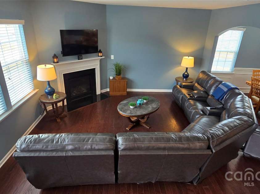 121 Mackinac Drive, Mooresville, NC 28117.  MLS# CAR4218931, YatesRealty ID 11674. Living Room w. Corner Fireplace and Lots of Natural Light