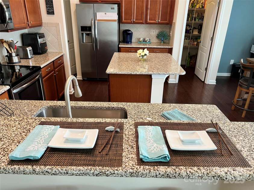 121 Mackinac Drive, Mooresville, NC 28117.  MLS# CAR4218931, YatesRealty ID 11674. Two-seater bar in kitchen.
