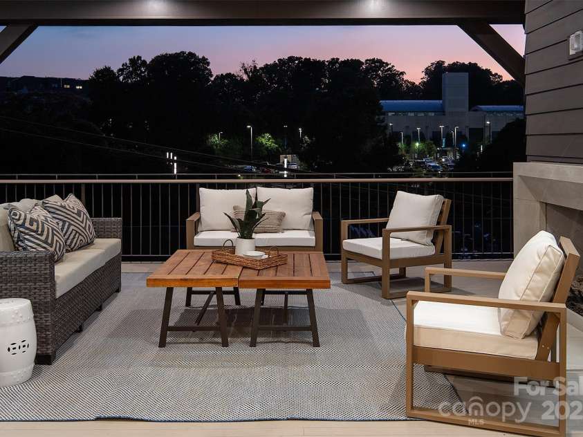 1214 Kings Drive, Charlotte, NC 28207.  MLS# CAR4215247, YatesRealty ID 11678. Gorgeous sunset views from upper back deck.