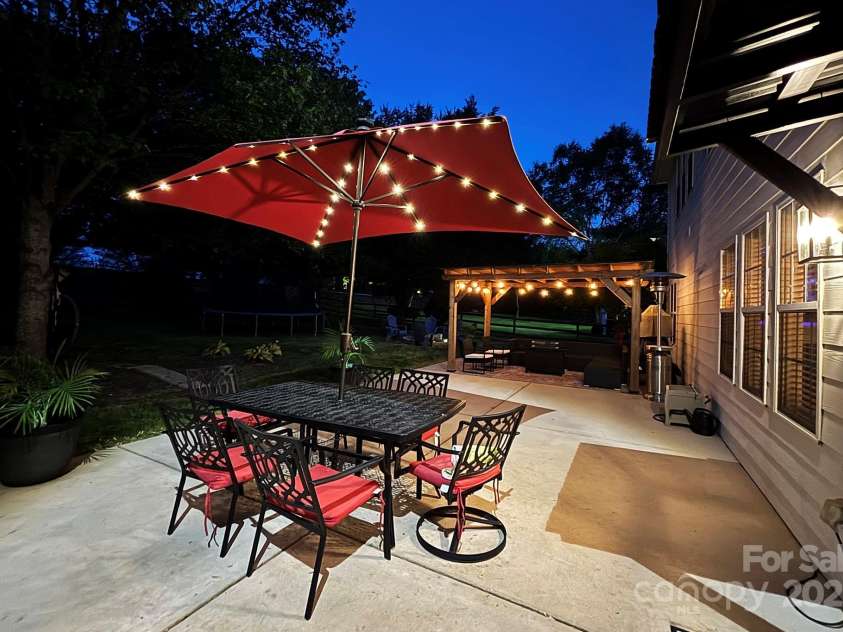 117 Middleton Place, Mooresville, NC 28117.  MLS# CAR4243590, YatesRealty ID 11681. Outdoor Living Space at Night