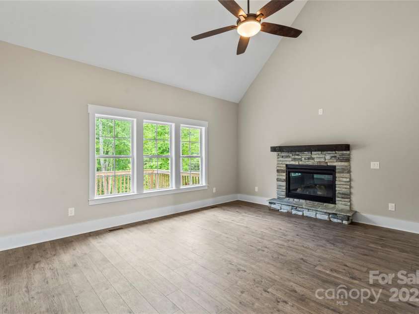 156 Clear Springs Road, Mooresville, NC 28115.  MLS# CAR4251662, YatesRealty ID 11684. Great room with stone fireplace & vaulted ceiling