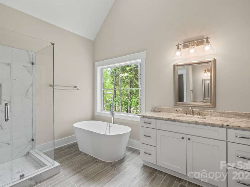 156 Clear Springs Road, Mooresville, NC 28115.  MLS# CAR4251662, YatesRealty ID 11684. Stunning master bathroom with tile shower & deep soaking tub