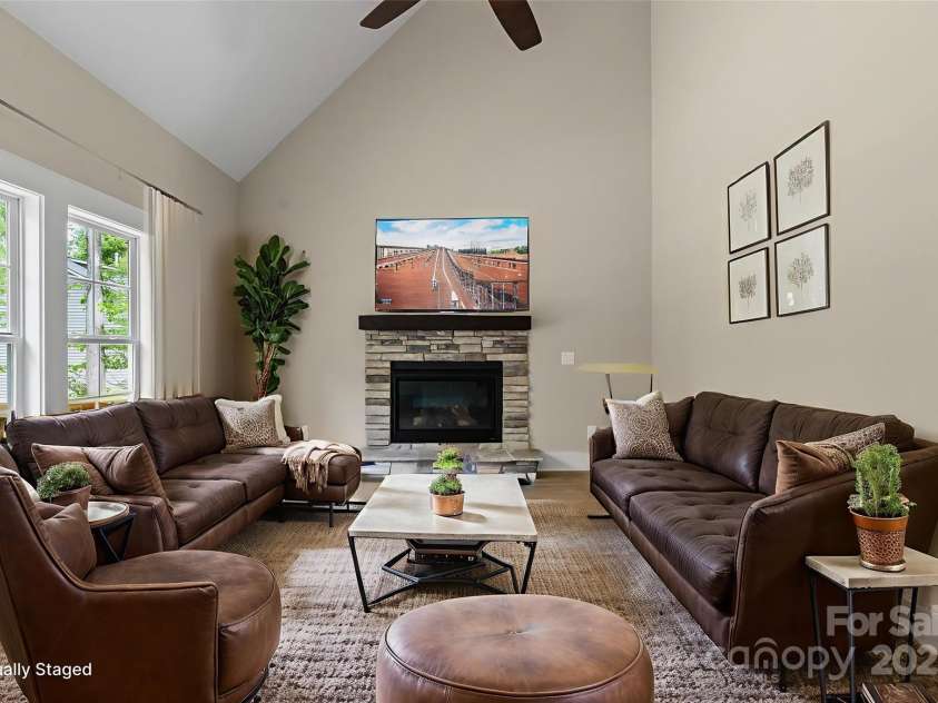 156 Clear Springs Road, Mooresville, NC 28115.  MLS# CAR4324685, YatesRealty ID 11684. Great room with vaulted ceiling & stone fireplace