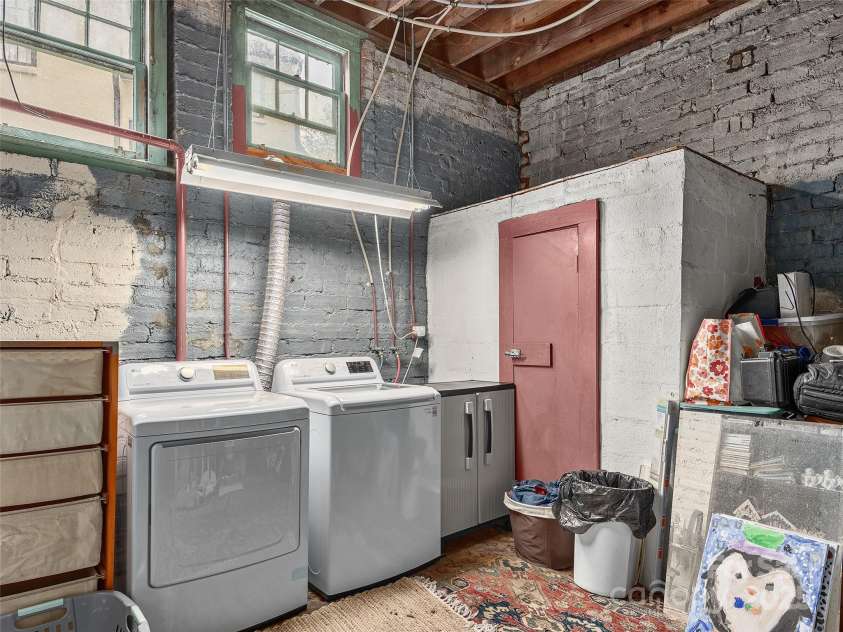 25 Normandy Road, Asheville, NC 28803.  MLS# CAR4180317, YatesRealty ID 11697. Basement laundry room has tons of storage