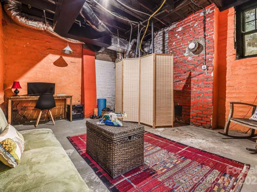 25 Normandy Road, Asheville, NC 28803.  MLS# CAR4313444, YatesRealty ID 11697. Unheated space in basement/great office,gym or guest space