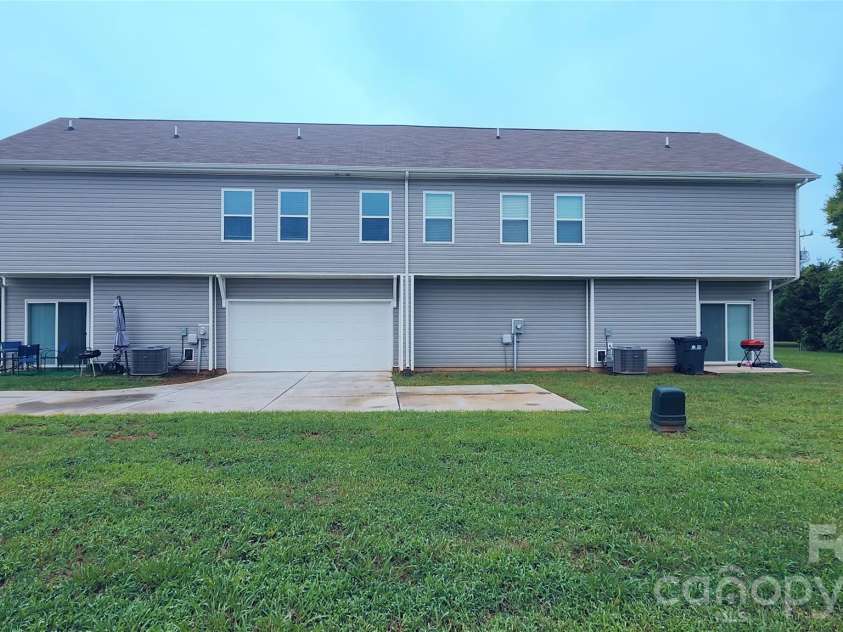 14727 Choate Circle, Charlotte, NC 28273.  MLS# CAR4287456, YatesRealty ID 11703. Back view from the flat, expansive backyard