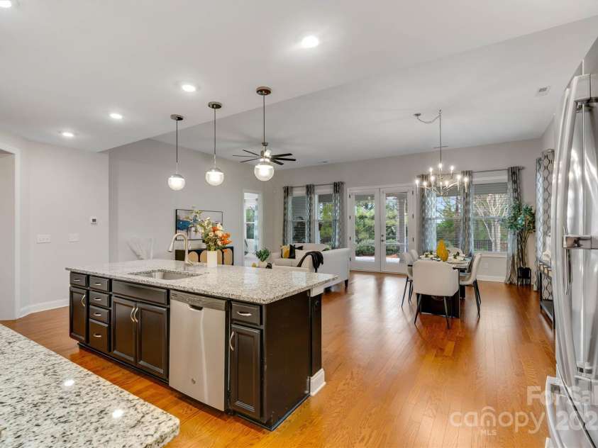 8210 Festival Way, Charlotte, NC 28215.  MLS# CAR4324351, YatesRealty ID 11707. Cook, chat, repeat! This kitchen is built for gatherings with a generous island and walk-in pantry.
