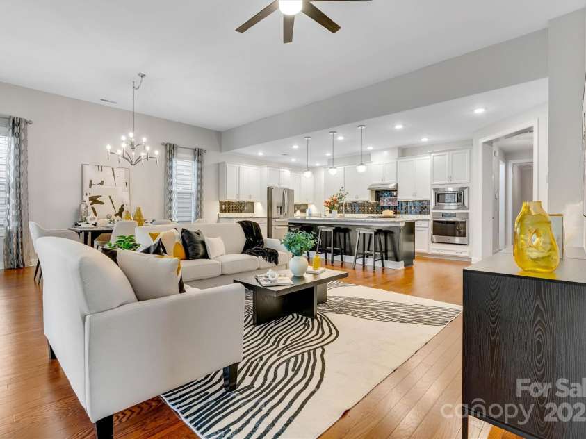 8210 Festival Way, Charlotte, NC 28215.  MLS# CAR4324351, YatesRealty ID 11707. Effortless flow from kitchen to living, all on beautiful wood floors - entertaining made easy.