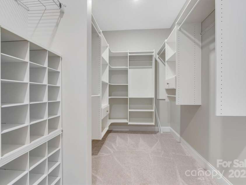 8210 Festival Way, Charlotte, NC 28215.  MLS# CAR4324351, YatesRealty ID 11707. From shoes to scarves, this custom closet has a perfect spot for it all!