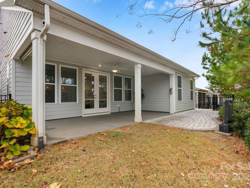 8210 Festival Way, Charlotte, NC 28215.  MLS# CAR4324351, YatesRealty ID 11707. Imagine quiet times spent in your private retreat! Covered lanai, extended patio, and a calming water feature that is perfect for relaxing or entertaining.