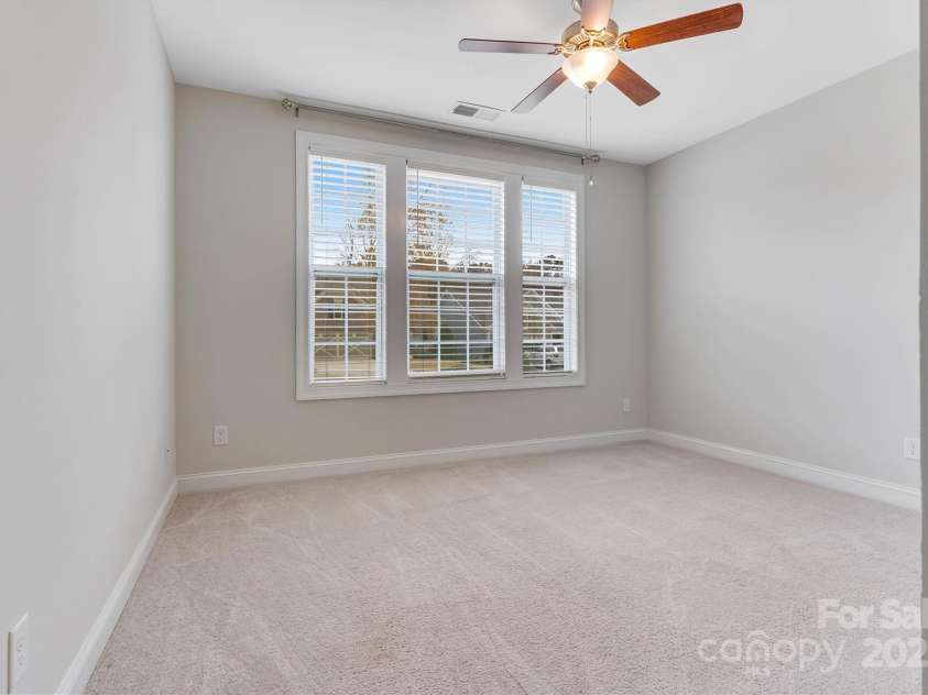 8210 Festival Way, Charlotte, NC 28215.  MLS# CAR4324351, YatesRealty ID 11707. The bedroom at the front of the home is sun-drenched and versatile - perfect as a guest room, home office, or a cozy den.