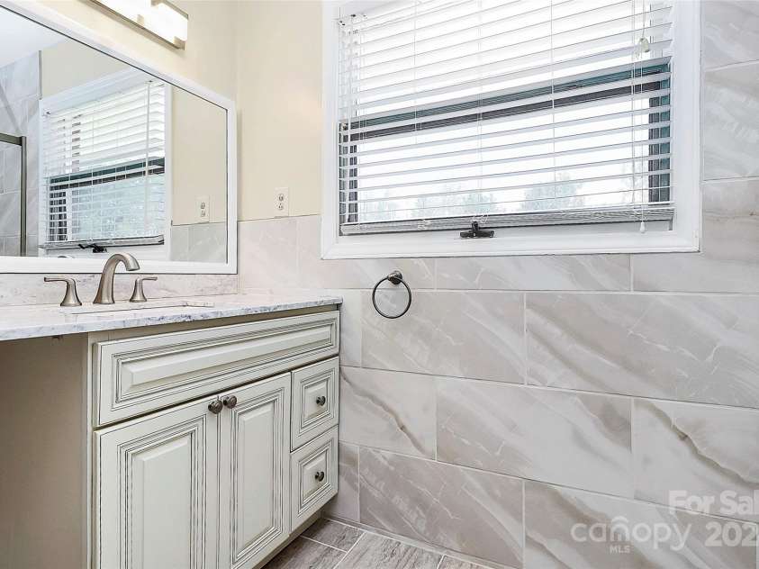 12708 Hamilton Road, Charlotte, NC 28273.  MLS# CAR4188404, YatesRealty ID 1171. Guest Bathroom Vanity