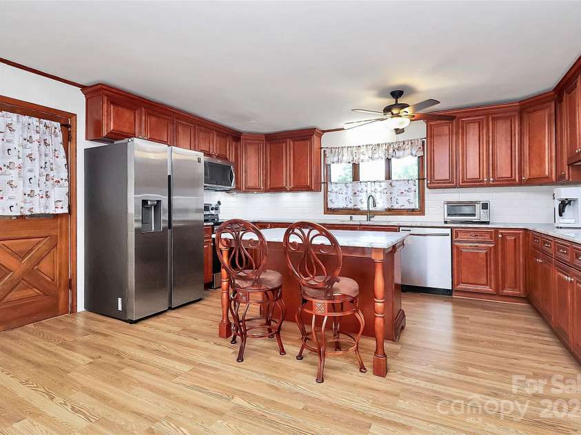 12708 Hamilton Road, Charlotte, NC 28273.  MLS# CAR4188404, YatesRealty ID 1171. Kitchen View from Dining Room Entrance