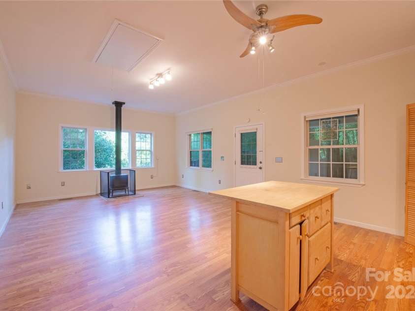 124 Wilds Branch Road, Marshall, NC 28753.  MLS# CAR4152556, YatesRealty ID 11710. Amazing flex space with kitchenette, woodstove, and separate entry