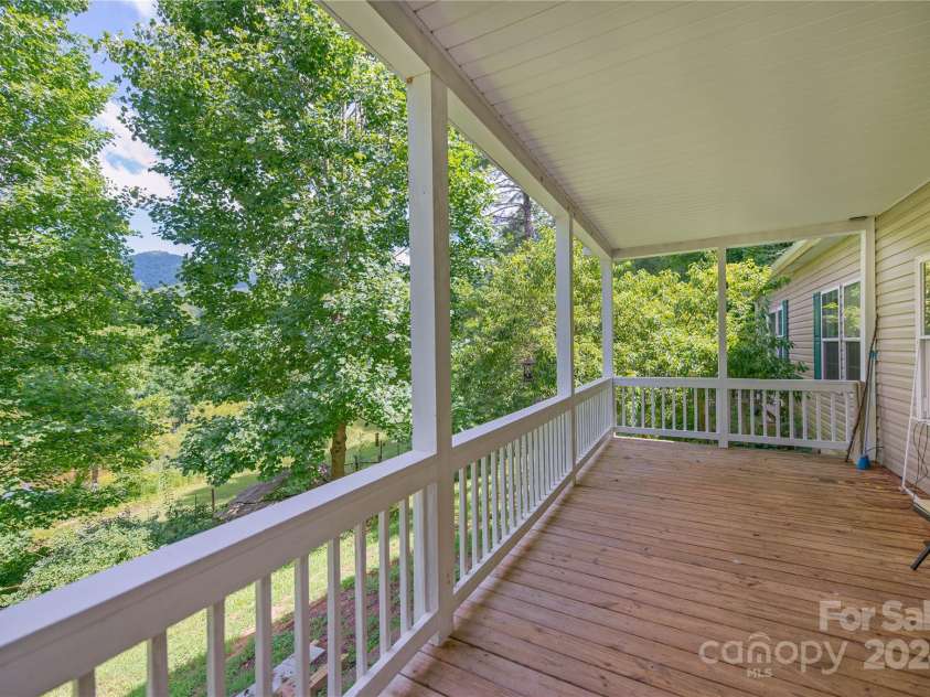 124 Wilds Branch Road, Marshall, NC 28753.  MLS# CAR4152556, YatesRealty ID 11710. Lovely porch views year round