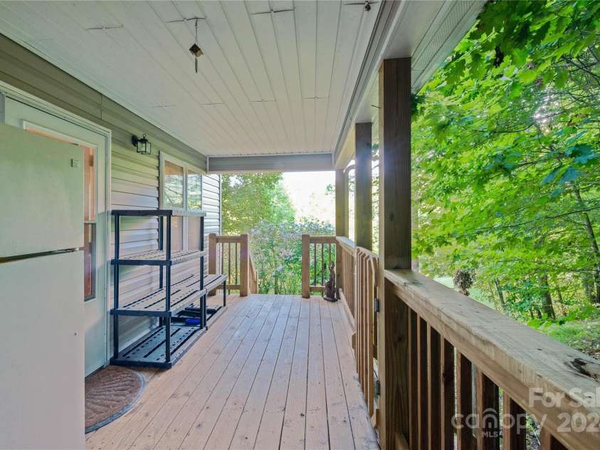 124 Wilds Branch Road, Marshall, NC 28753.  MLS# CAR4152556, YatesRealty ID 11710. Private side porch entry to flex space