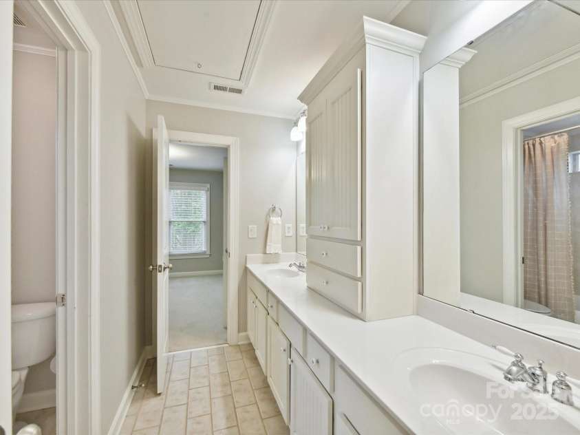 3200 Delamere Drive, Matthews, NC 28104.  MLS# CAR4250146, YatesRealty ID 11722. Bathroom connects two bedrooms on second level.