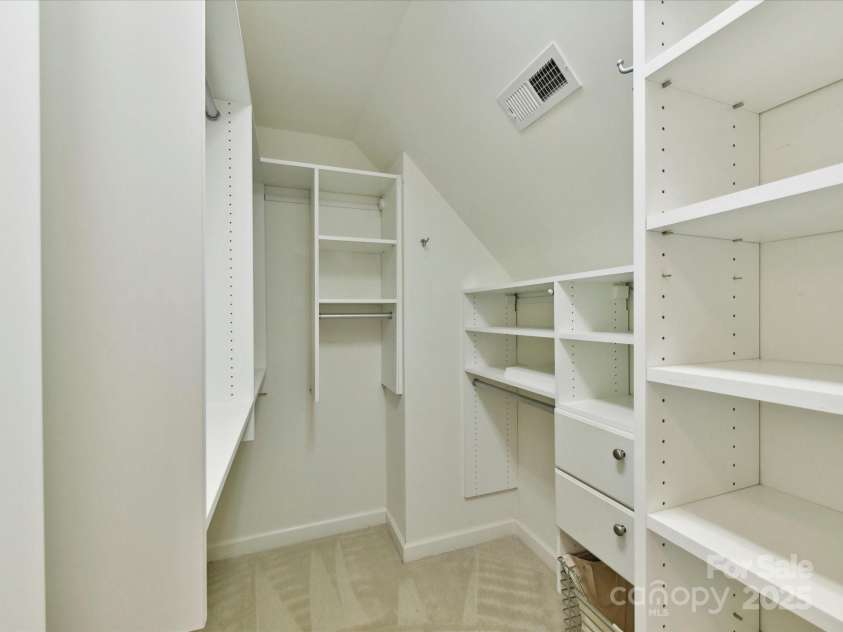 3200 Delamere Drive, Matthews, NC 28104.  MLS# CAR4250146, YatesRealty ID 11722. One of the two walk in closets in Primary Bedroom
